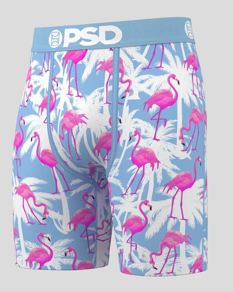 PSD boxer briefs with blue waistband featuring pink flamingos and white palm leaves on light blue background.