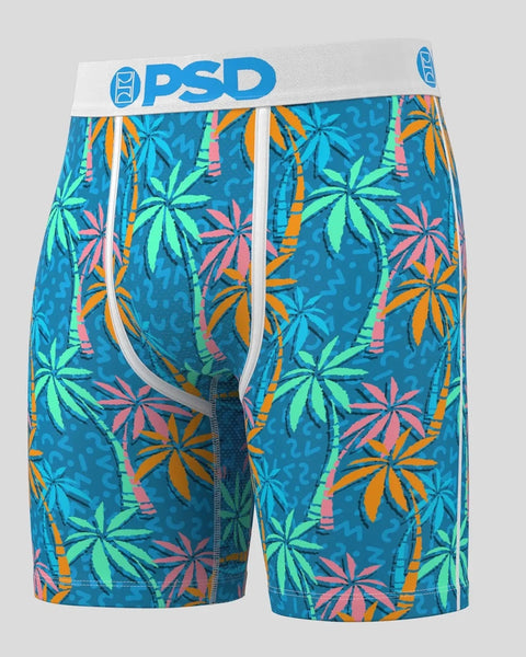 Teal boxer briefs with colorful palm tree and tropical leaf pattern, white waistband with blue PSD logo.