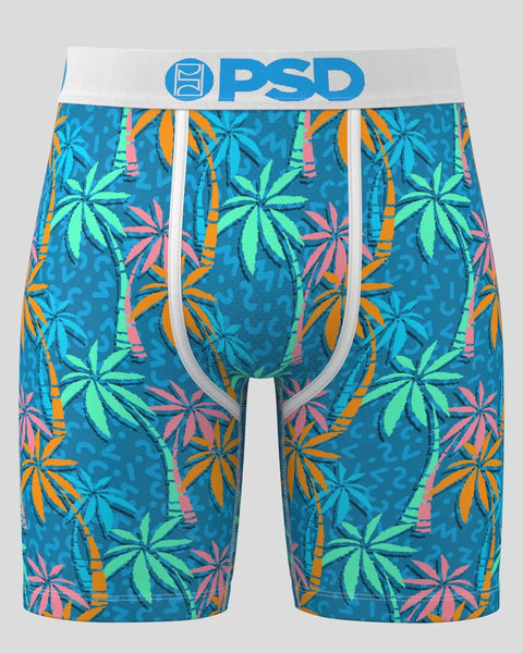 Teal boxer briefs with colorful palm and bamboo print, white waistband with blue PSD logo.