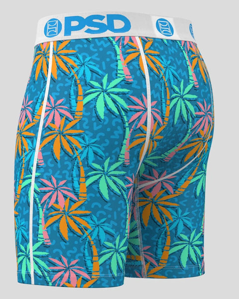 Teal boxer shorts with colorful palm leaf and bamboo print, white PSD waistband with logo.