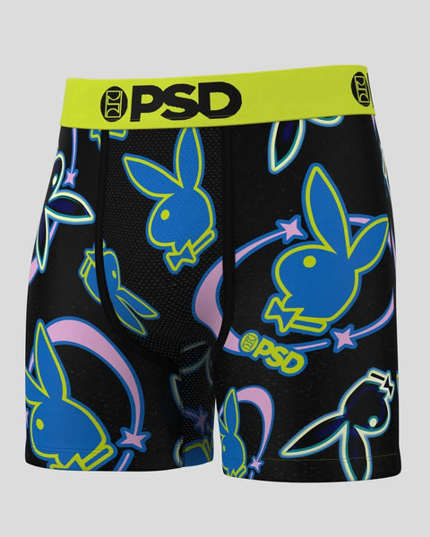 PSD brand boxer shorts with neon blue and yellow Playboy bunny heads and stars on black background.