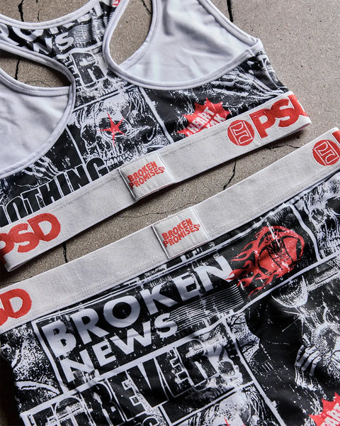 White sports bras with black and red graphic prints featuring skull imagery and 