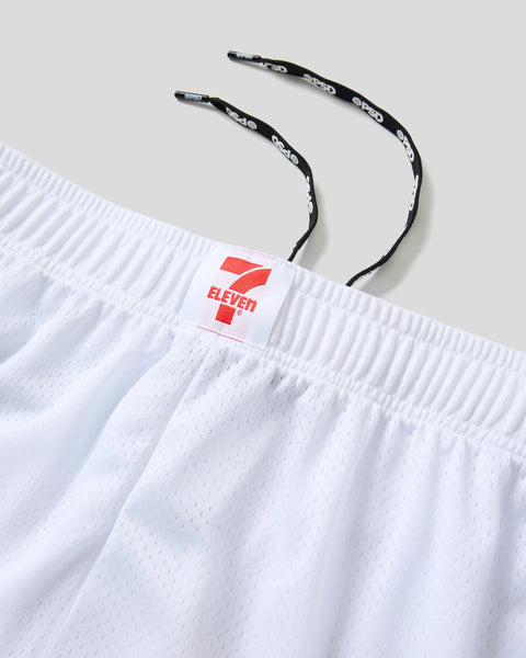 White mesh shorts with 7-Eleven logo label and black drawstring with white detailing.
