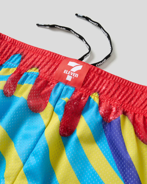 Red athletic short with blue and yellow striped pattern, cherry Slurpee graphic print, and black drawstring with 7-Eleven bra
