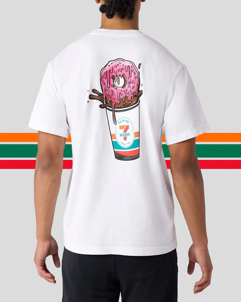 White t-shirt with back graphic of pink frosted donut in 7-Eleven cup with chocolate sticks and colorful striped sleeves.