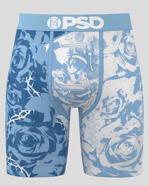 Blue PSD boxer shorts with rose and thorn pattern in cream and navy tones, featuring branded waistband.